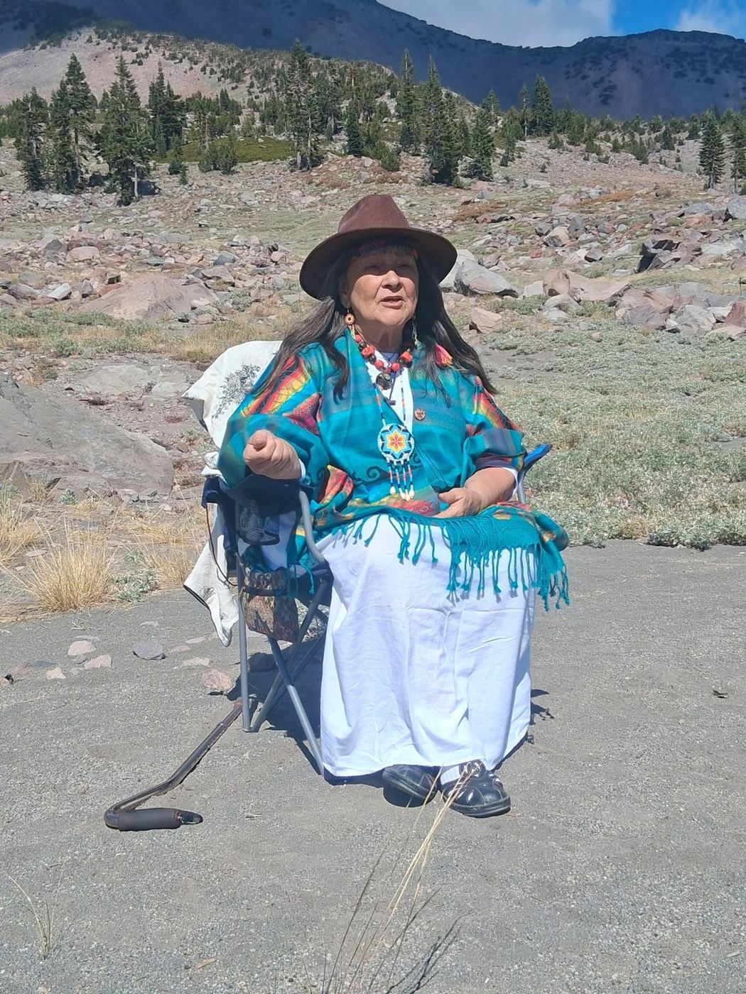 Grandmother Ejna Fleury seated at Mt. Shasta