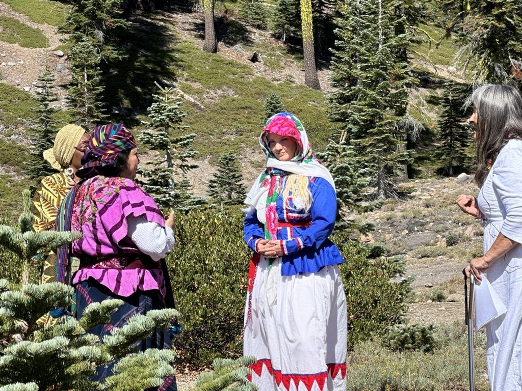 Elders in ceremony among the pines at Mt. Shasta